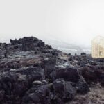 Autarke Schutzhütte auf dunklem Felsgestein in Island