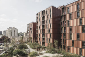 Holzbau-Gebäudekomplex »Wood‘Art« in Toulouse mit Terrakotta-Fassade