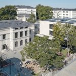 Kreative Putztechnik für Fassaden von Grundschule und umgebautem Hort. Bild: W&V Architekten